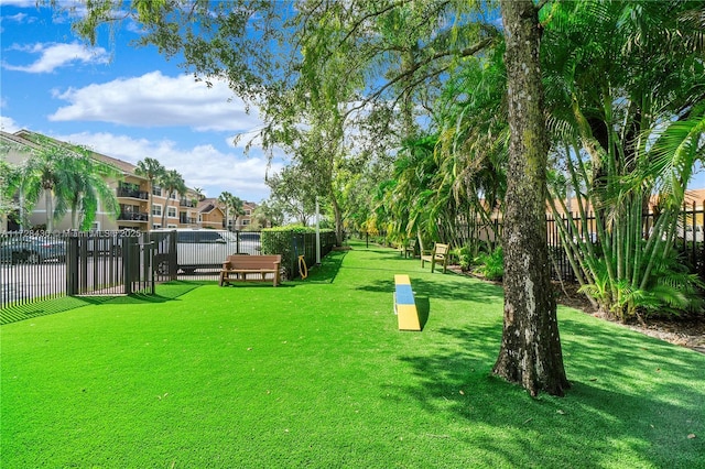 view of home's community with a lawn