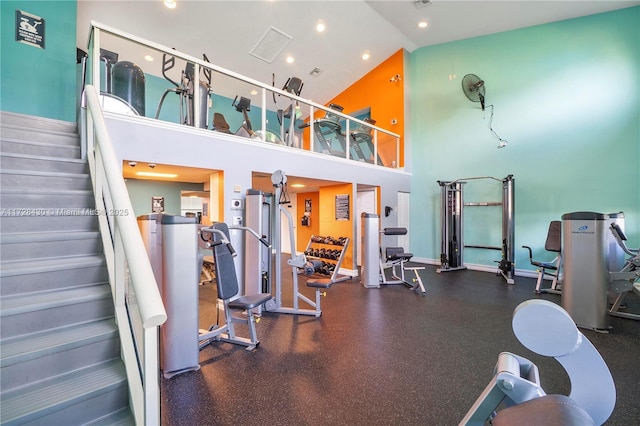 gym with a towering ceiling