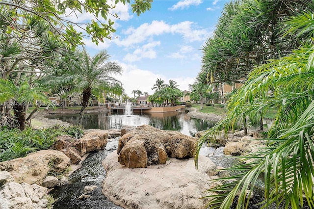 surrounding community featuring a water view