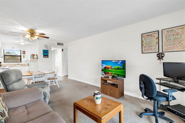 living room featuring ceiling fan