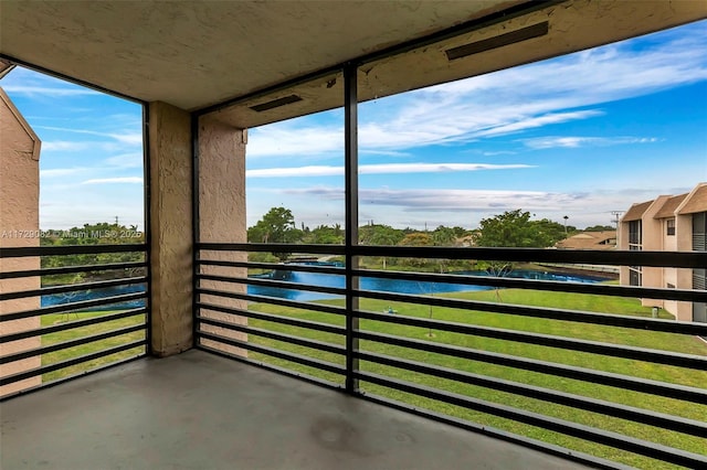 balcony featuring a water view