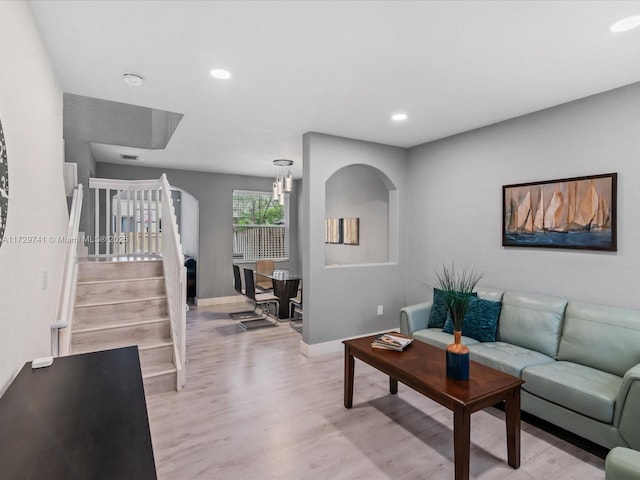 living room with light hardwood / wood-style flooring