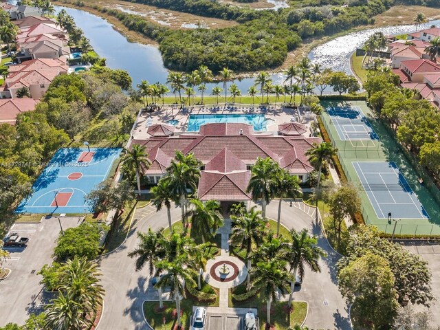 birds eye view of property with a water view