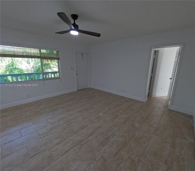 empty room featuring ceiling fan