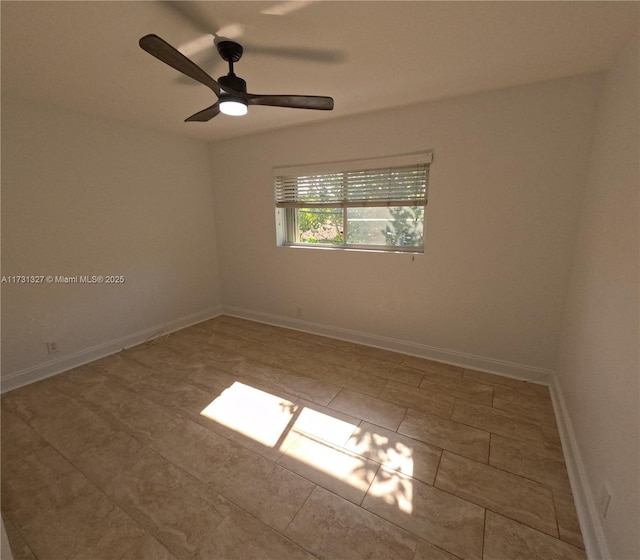 empty room featuring ceiling fan