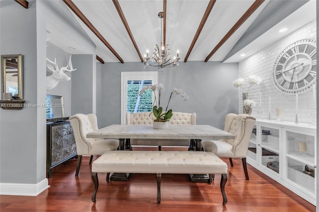 dining room with hardwood / wood-style flooring, lofted ceiling with beams, and a notable chandelier