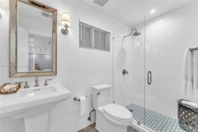491 SW 22nd Rd, Miami, FL 33129 - bathroom featuring a shower stall, toilet, and a sink