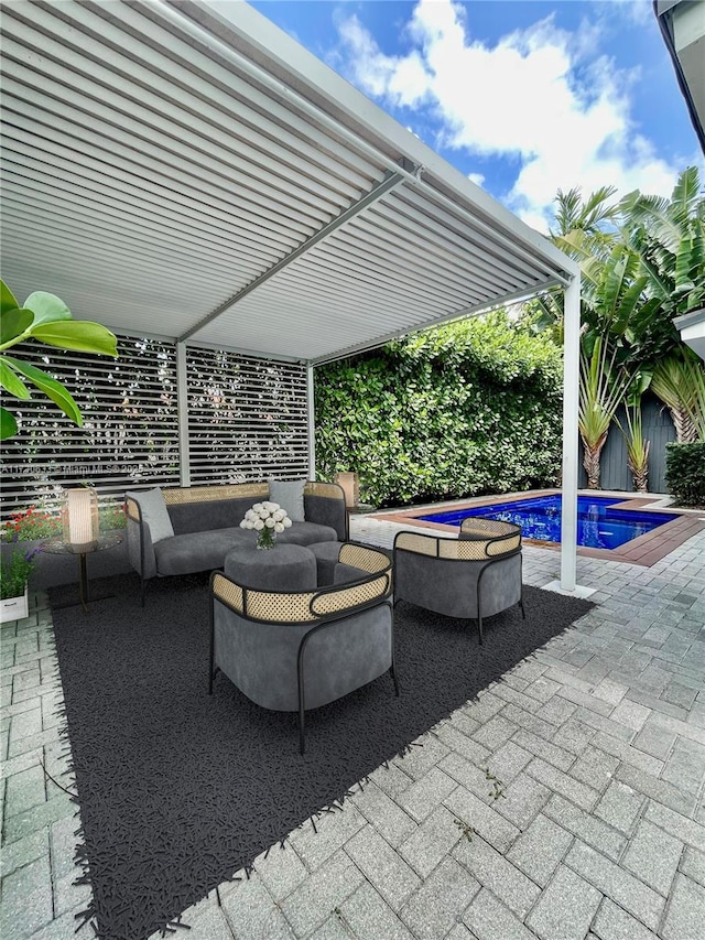 view of patio featuring outdoor lounge area, a fenced backyard, and a fenced in pool