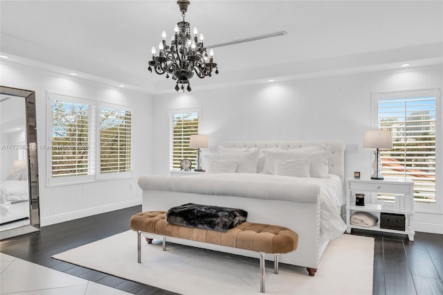 bedroom with wood finished floors and recessed lighting