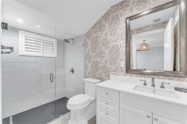 bathroom featuring a stall shower, toilet, wallpapered walls, and visible vents