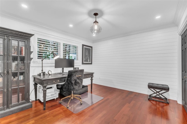 office space with ornamental molding, wooden walls, recessed lighting, and wood finished floors