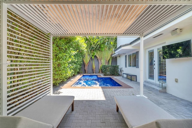 view of swimming pool featuring a patio area, french doors, and a hot tub