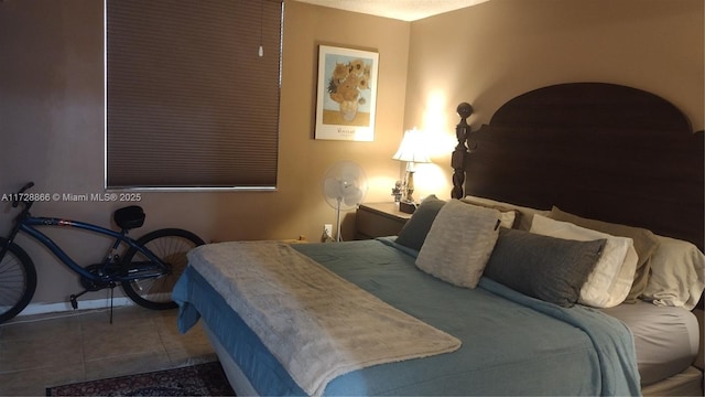 bedroom featuring dark tile patterned floors