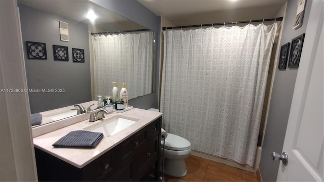 full bathroom with tile patterned flooring, vanity, toilet, and shower / bath combo with shower curtain