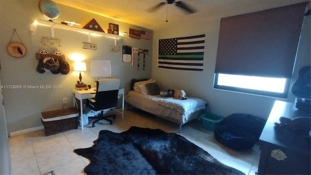 bedroom featuring light tile patterned floors and ceiling fan