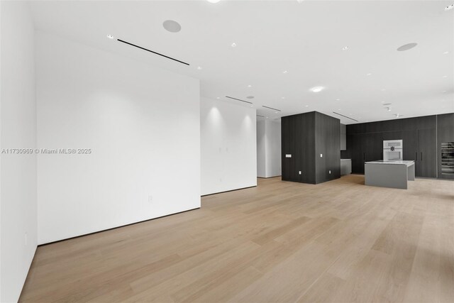 unfurnished living room featuring light wood-type flooring