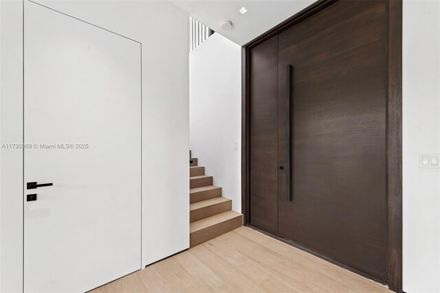 staircase featuring hardwood / wood-style floors