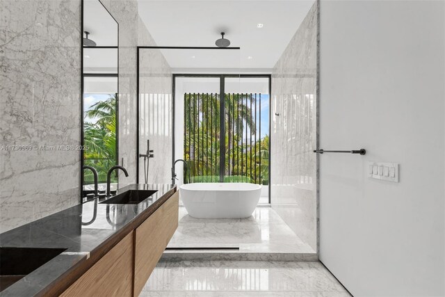 bathroom with vanity and a bathtub