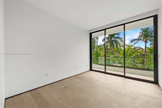 spare room featuring light hardwood / wood-style floors