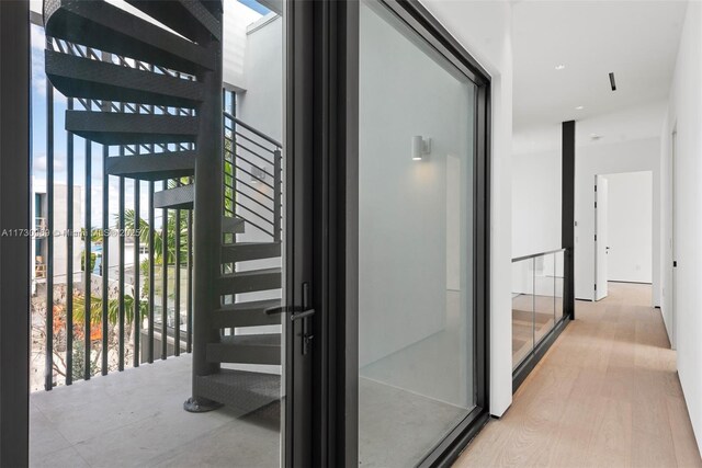 hallway with light wood-type flooring