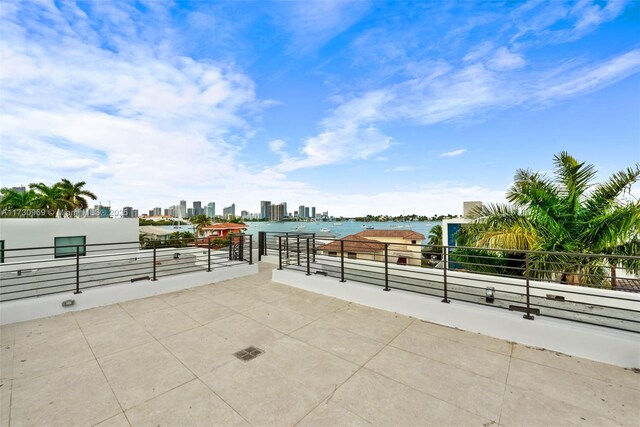 view of patio with a water view