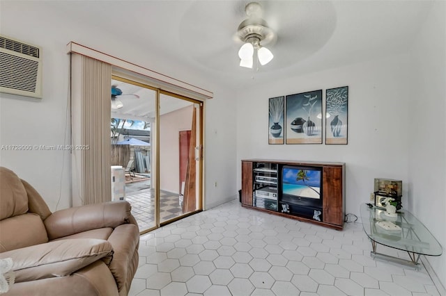 living room with a wall mounted air conditioner and ceiling fan