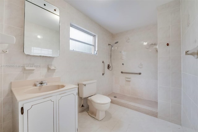 bathroom featuring vanity, toilet, tile walls, and a tile shower