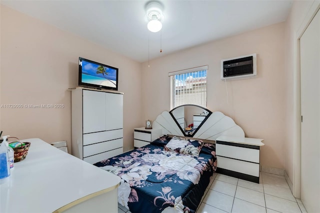 tiled bedroom with a wall unit AC