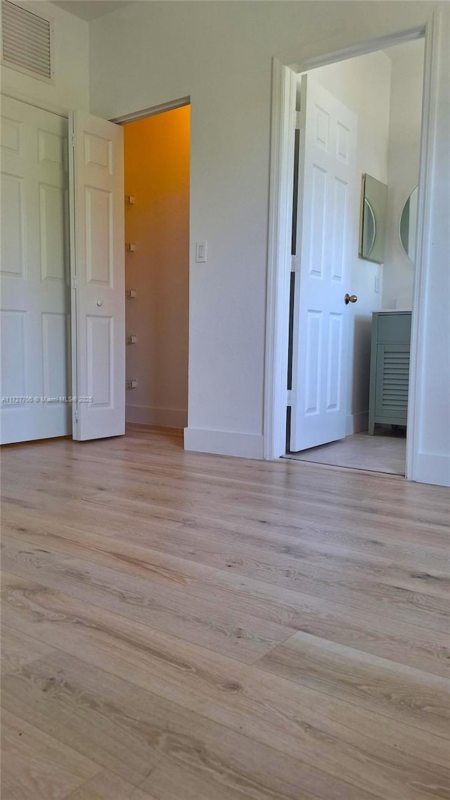 unfurnished bedroom featuring light hardwood / wood-style flooring