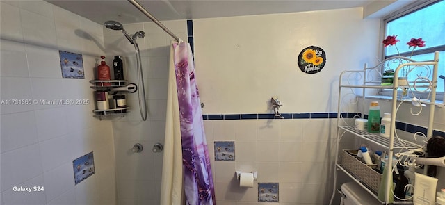 bathroom with a shower with shower curtain