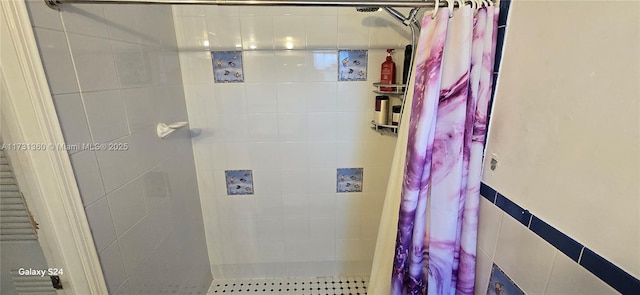 bathroom with a shower with shower curtain