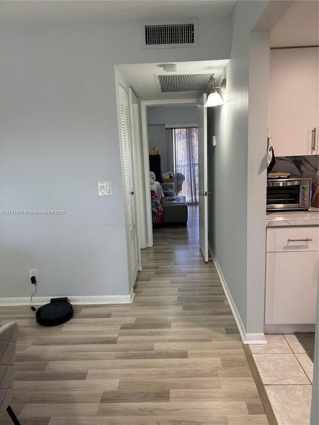 hall featuring light wood-type flooring