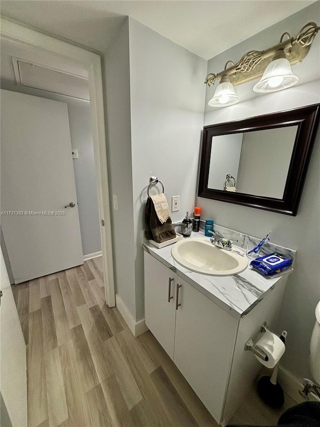 bathroom featuring vanity and hardwood / wood-style floors