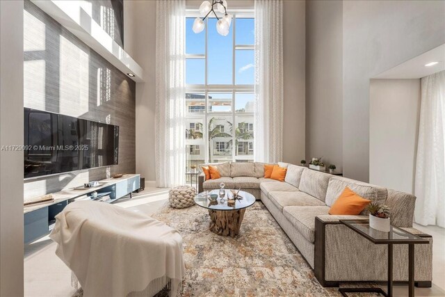 living room featuring a towering ceiling