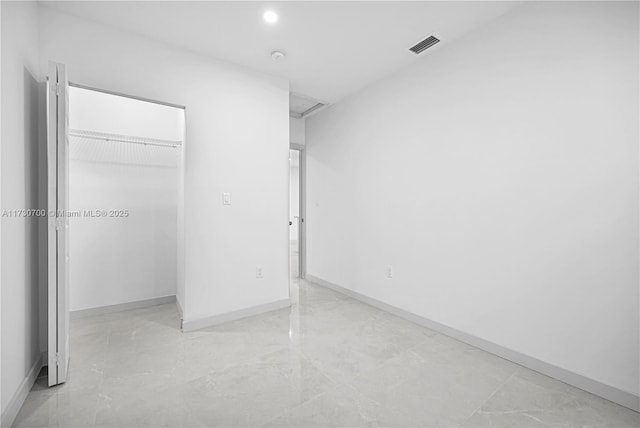 unfurnished bedroom with a closet