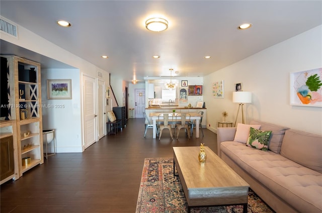 2035 NE 123rd St, North Miami, FL 33181 - living room with dark wood-type flooring, recessed lighting, and baseboards