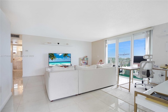 tiled living room with expansive windows