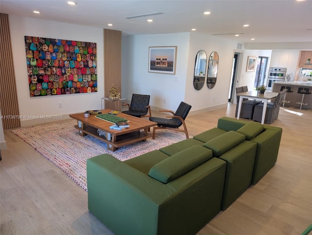 living room with light hardwood / wood-style floors