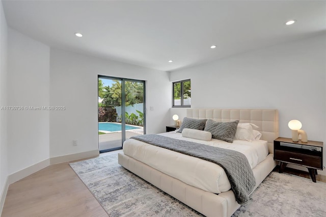 bedroom with access to outside and light hardwood / wood-style floors