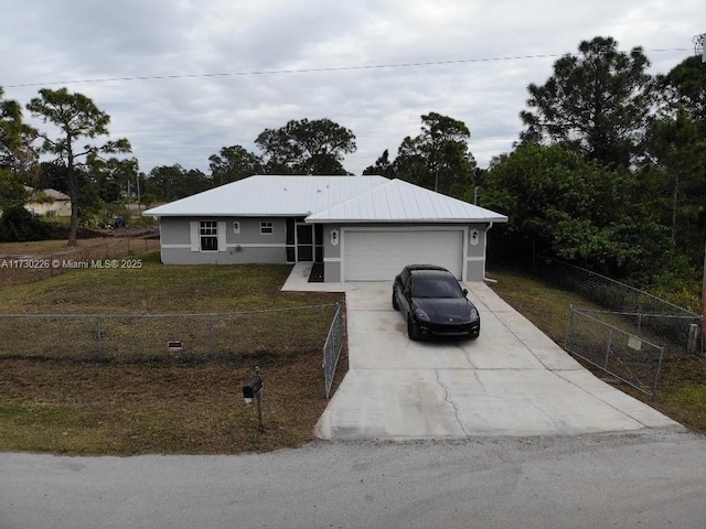 single story home featuring a garage and a front yard