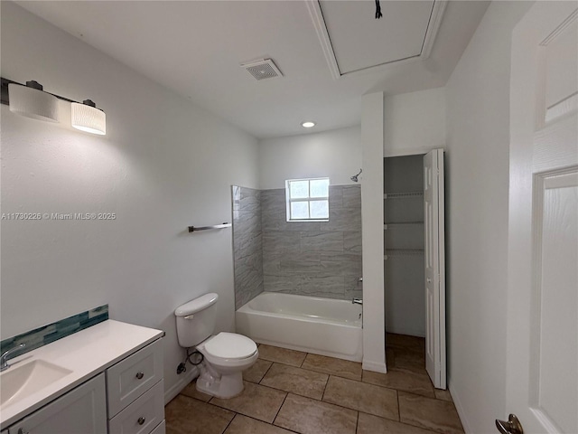 full bathroom with tile patterned floors, vanity, toilet, and tiled shower / bath combo