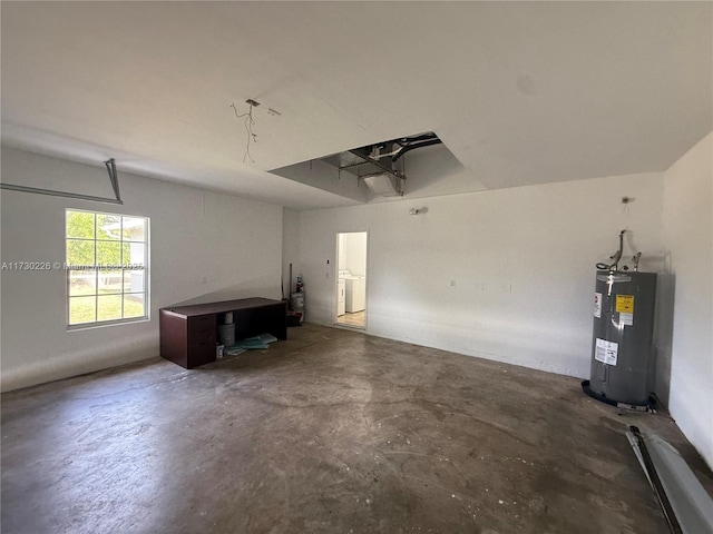 garage featuring washer / dryer and water heater