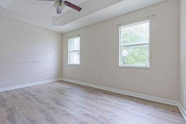 unfurnished room featuring ceiling fan and light hardwood / wood-style flooring