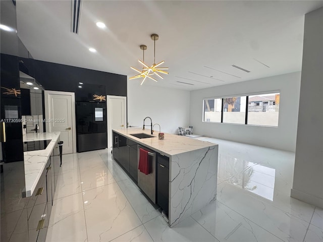 kitchen with a large island, sink, refrigerator, light stone counters, and black electric stovetop