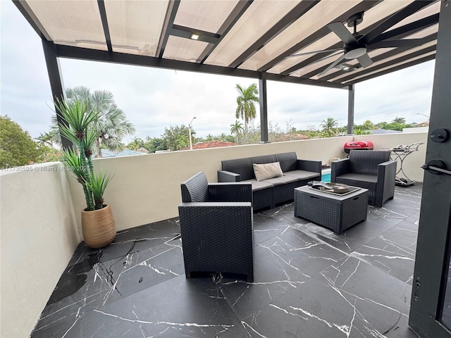 view of patio with ceiling fan and an outdoor living space