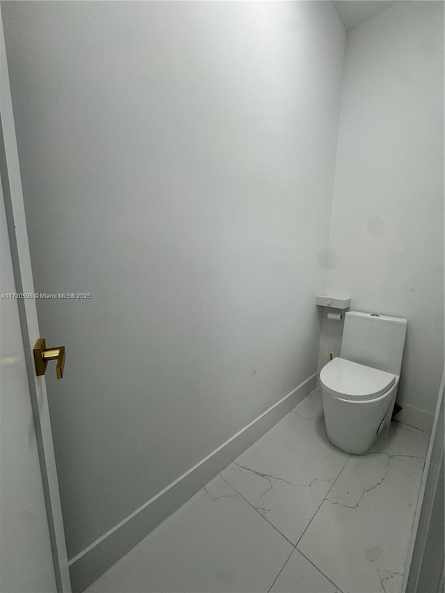 bathroom featuring toilet