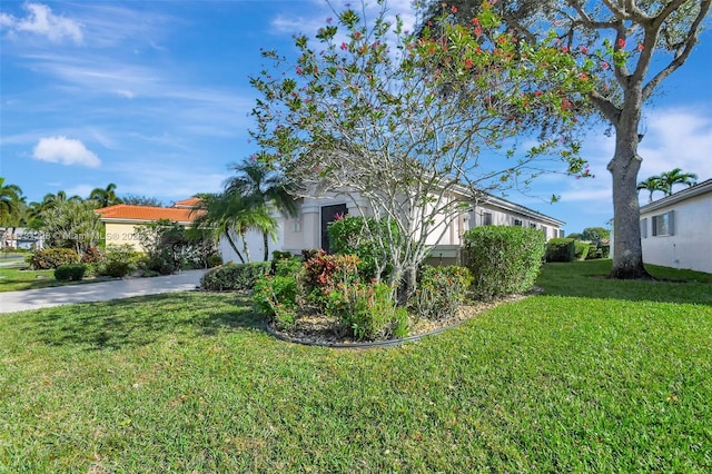 12915 Coral Lakes Dr, Boynton Beach, FL 33437 - view of property exterior featuring a lawn and driveway