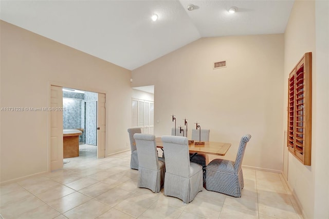 12915 Coral Lakes Dr, Boynton Beach, FL 33437 - dining room featuring light tile patterned flooring, baseboards, and high vaulted ceiling
