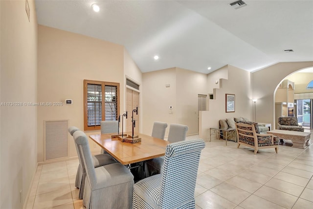 12915 Coral Lakes Dr, Boynton Beach, FL 33437 - dining room with arched walkways, vaulted ceiling, light tile patterned floors, baseboards, and recessed lighting