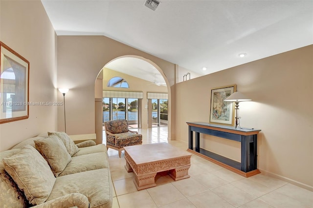 12915 Coral Lakes Dr, Boynton Beach, FL 33437 - living area featuring lofted ceiling, arched walkways, a water view, light tile patterned floors, and a ceiling fan